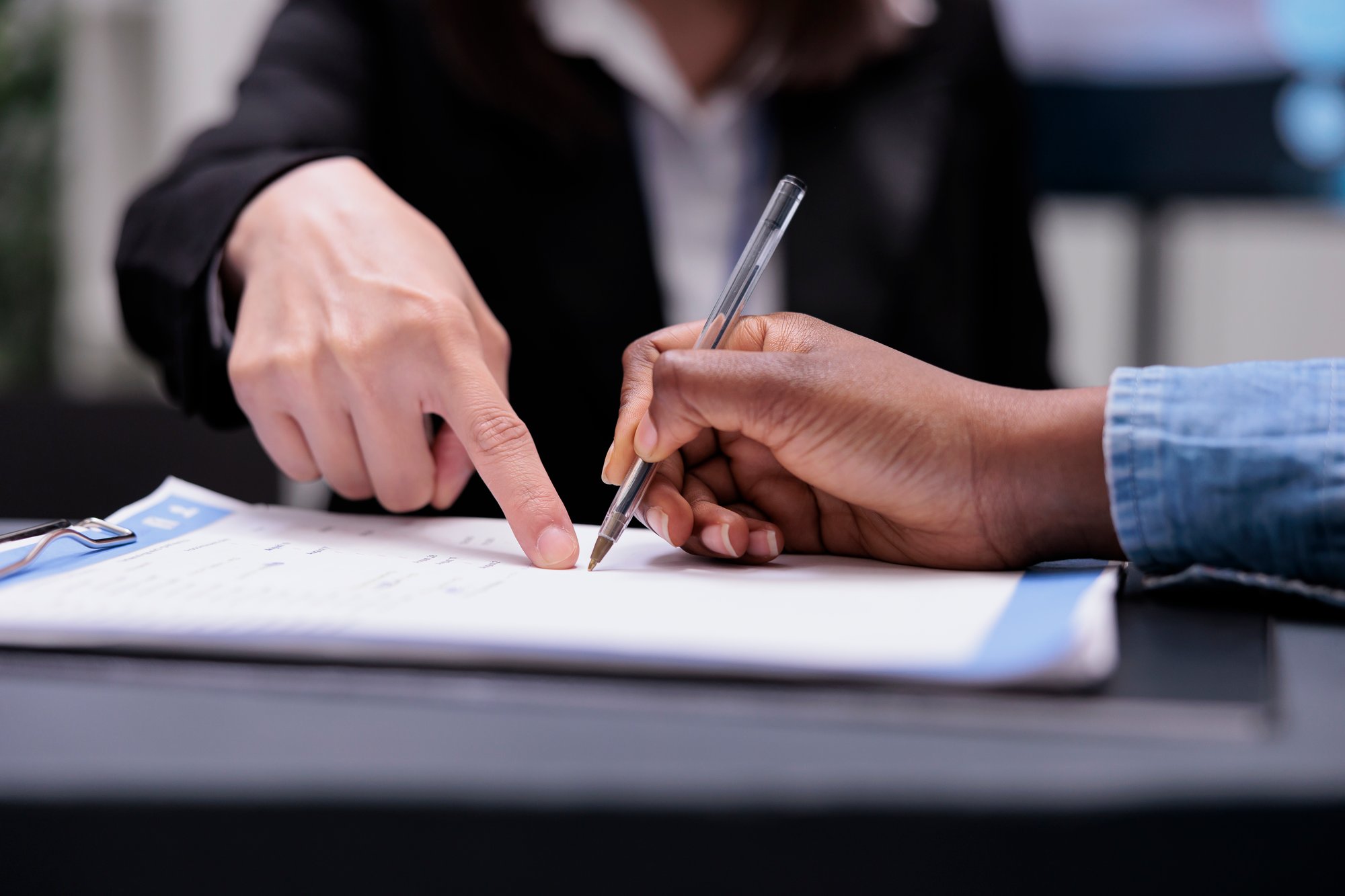 patient-filling-report-papers-reception-desk-signing-registration-forms-before-attending-checkup-visit-appointment-woman-writing-checkup-files-with-receptionist-healthcare-support-close-up